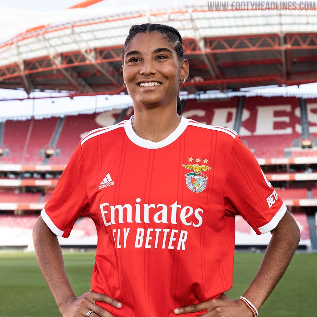 Close-up of Benfica 2023/24 Home Jersey with 120 Anos gold detail on the collar; SL Benfica vs Real Madrid 4-2 match atmosphere at Estádio da Luz.